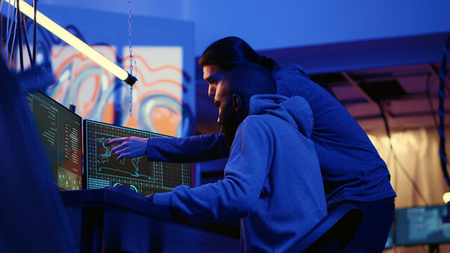 Teamworking spies contracted by government to do international espionage warfare on other countries, using advanced technology computer equipment to infiltrate past protection firewalls.