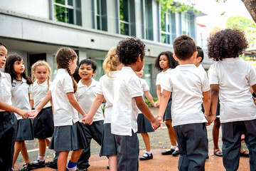 Fototapeta premium Children playing outdoors in school