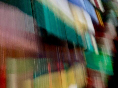 Abstract Motion Blur of Colorful Books on a Bookshelf