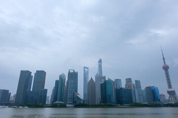 Fototapeta premium The Pedestrian Walkway along the Huangpu River with the Oriental Pearl Tower in North Bund, Shanghai, Taken in 2018