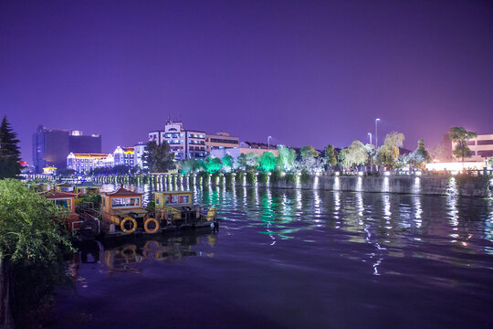 Night View of Boats, Lights and Buildings on the Ancient Canal in Wuxi, Jiangsu, China