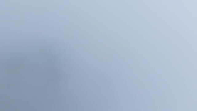 Aerial hyperlapse of thick fog and mist moving over Seongjusan Mountain in Boryeong, South Korea