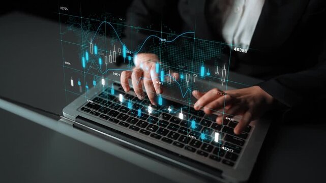 Business professional analyzing financial data with holographic graphs on laptop screen in modern office environment with soft lighting. Entropy.