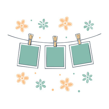Hanging photo frames with flowers on string