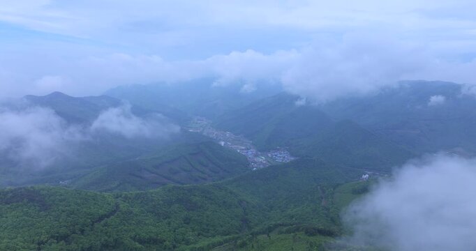 seongjusan, boryeong, south korea, aerial view, drone shot, hyperlapse, timelapse, mountain fog, mist, misty morning, cloudy sky, fast motion, atmospheric, majestic nature, serene landscape, pine tree