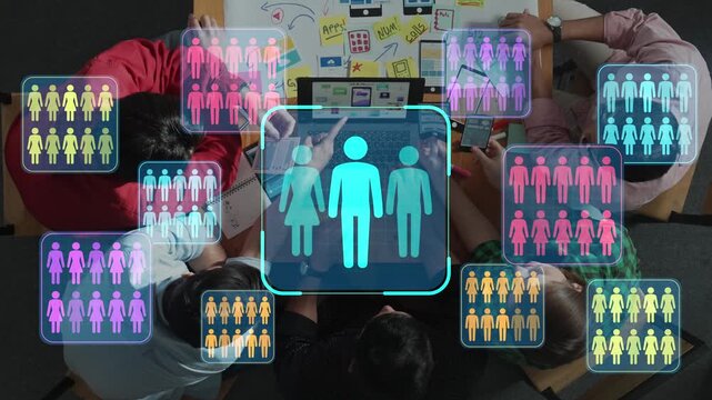 People collaborating on a project with colorful icons representing teamwork, communication, technology, and diverse ideas in a modern workspace setting. Entropy.