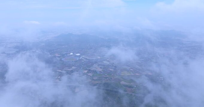 seongjusan, boryeong, south korea, aerial view, drone shot, hyperlapse, timelapse, mountain fog, mist, misty morning, cloudy sky, fast motion, atmospheric, majestic nature, serene landscape, pine tree