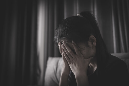 A vulnerable woman sitting alone portrays depression, psychological abuse, low self-esteem, and the struggle to heal from traumatic experiences.