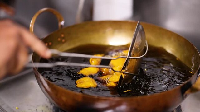 Deep Frying Indian Pakora in a Traditional Brass Kadai Wok