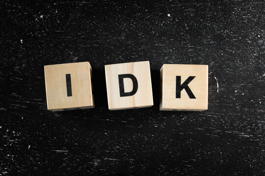Wooden Block words on black background.