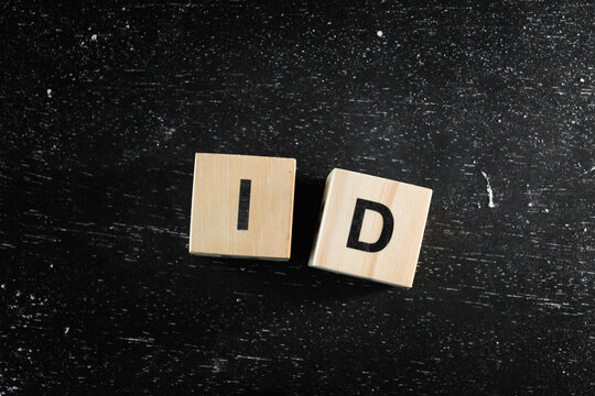 Wooden Block words on black background.