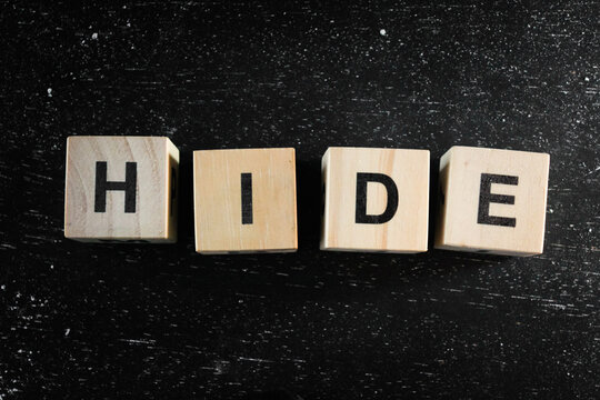 Wooden Block words on black background.