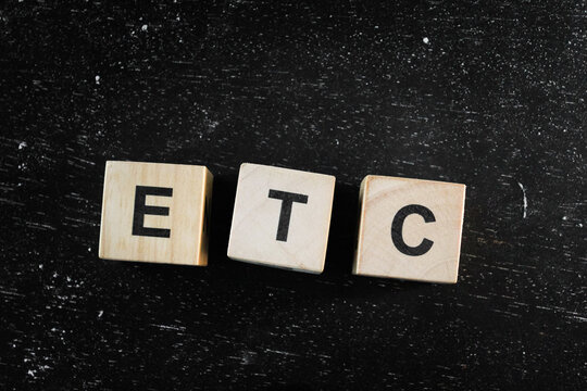 Wooden Block words on black background.