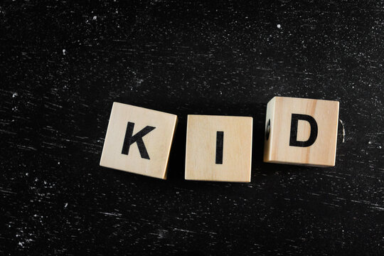 Wooden Block words on black background.