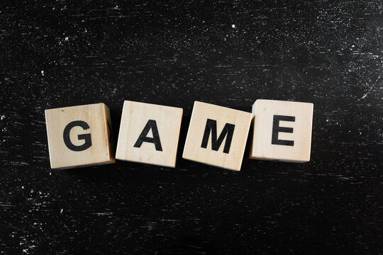 Wooden Block words on black background.