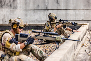 Fototapeta premium Sniper Team Conducting Rooftop Overwatch