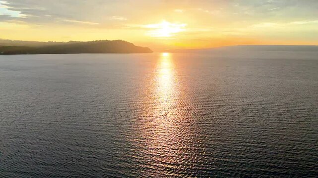 Cinematic aerial view of sunset at Lake Toba