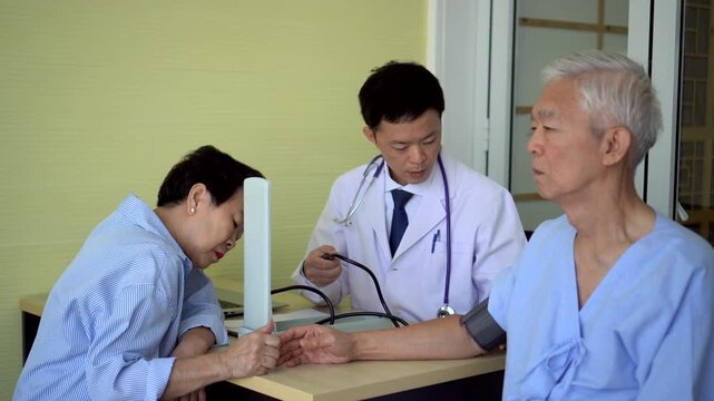 Asian senior couple check up with doctor at hospital longevity care medical trend