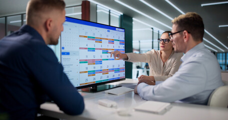 Business Manager Pointing At Calendar © Andrey Popov