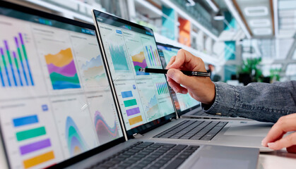 Fototapeta premium Experienced Financial Analyst Reviewing Multiple KPI Dashboards