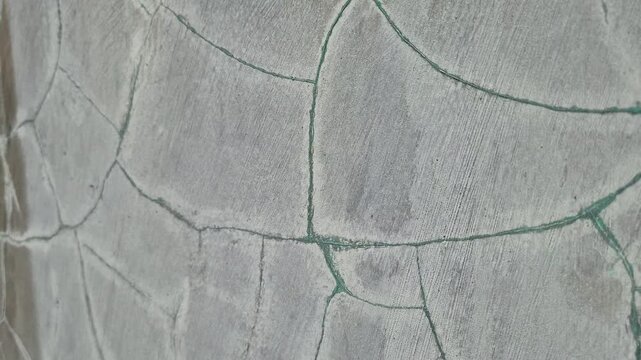 Close Up of Mesh Crack Pattern Texture on Gray Concrete Wall - Dolly Out Shot