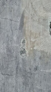 Close Up of Cracked Grey Concrete Wall Texture with Weathered Grunge Look