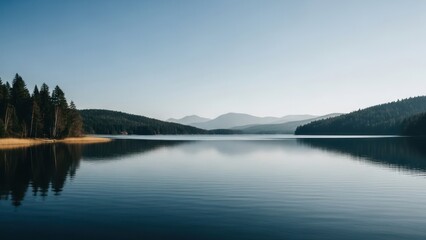 Fototapeta premium Serene Mountain Lake Reflection with Pine Trees and Clear Sky.
