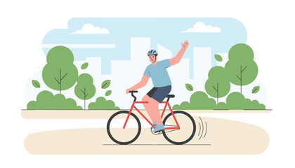 Fototapeta premium Happy man wearing a safety helmet waves as he rides his red bicycle along a park pathway on a clear sunny day.