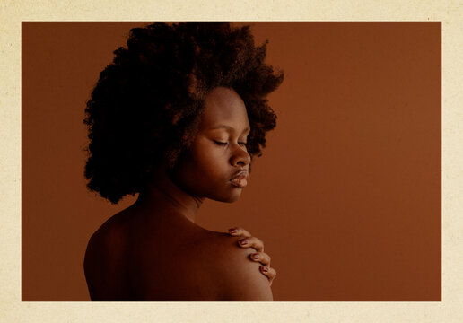 Serene portrait of woman with natural afro hairstyle