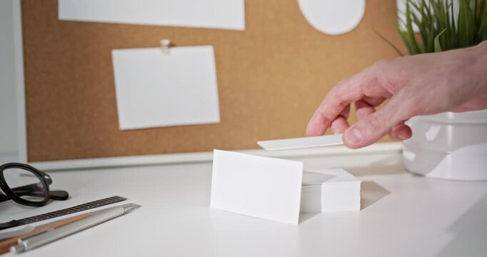 Blank white business card mockup on minimalist office desk