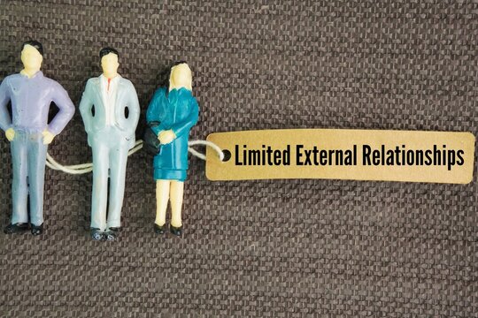 Miniature people and paper tags with the words Limited External Relationships. restricted, arm's-length interactions between an organization (or individual) and outside entities like suppliers, regula