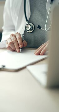 Medical doctor completing administrative healthcare records