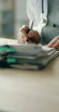 Medical doctor completing administrative healthcare records