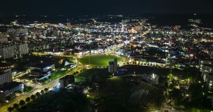 Aerial hyperlapse of Boryeong city roundabout from sunset to night, South Korea
