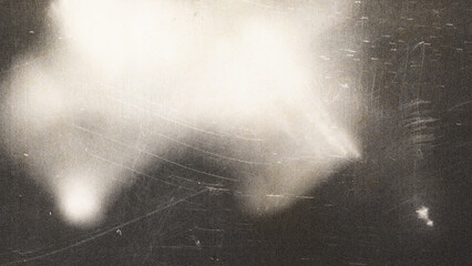 Cinematic film grain texture with soft light leaks, vintage analog photography aesthetic on dark...