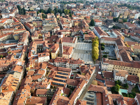 Aerial view of the historic center with red-tiled rooftops and the central square in Biella, Piedmont, Italy.