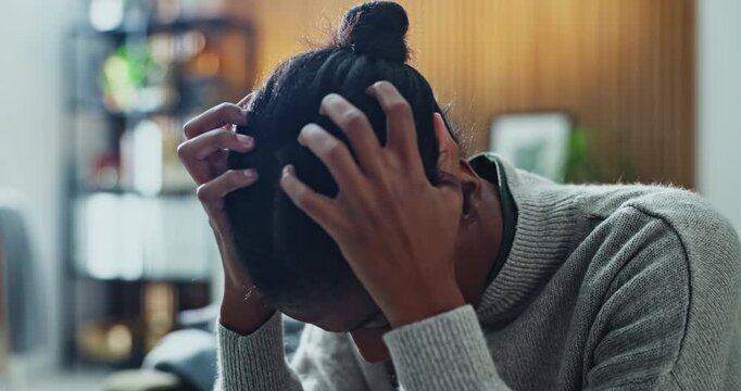 Black woman, stress and panic in home for mistake, fear or loss with pressure or phobia. Trauma, overthinking or female person with depression in living room with anxiety for mental health or worry