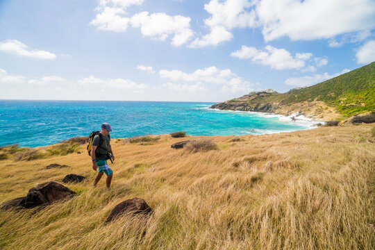 Man hiking on a beautiful tropical coastline