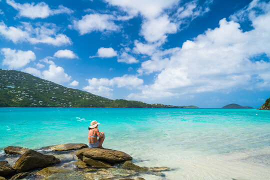 Woman in sun hat enjoying the tropical view
