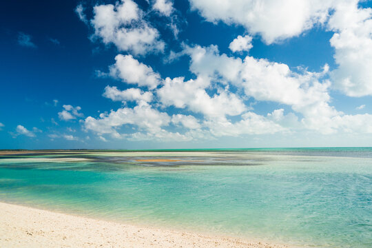 Shallow turquoise ocean waters on a beautiful tropical beach