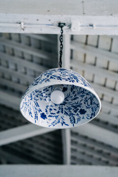Ceramic pendant light with blue and white floral pattern