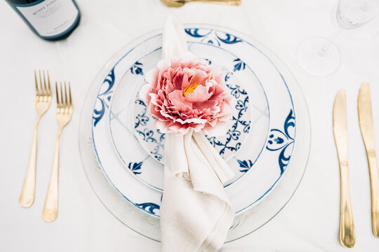 Elegant table setting with white and blue patterned plates