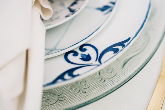 Elegant table setting featuring blue and white porcelain plates