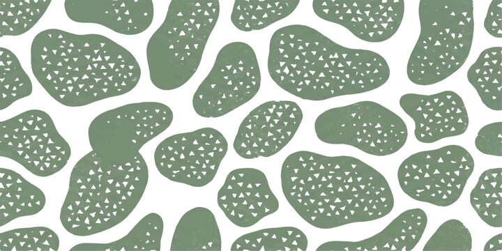 Abstract organic shapes in sage green with small white dots, creating a natural, speckled pattern on a white background.