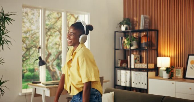 Headphones, dance and excited black woman in home with energy, song or remote work celebration. Music, happy person and moving with rhythm, spinning or freelancer listening to audio for achievement