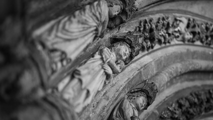 Close-up of the statue in the medieval stone church entrance © Matt A. Hawk