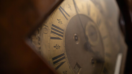 Close-up on the face of the old, wooden clock © Matt A. Hawk