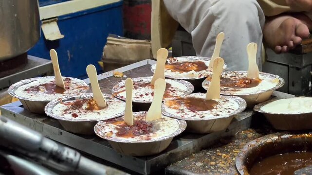 Indian tasty street food dahi vada. It is prepared by soaking vadas in thick dahi