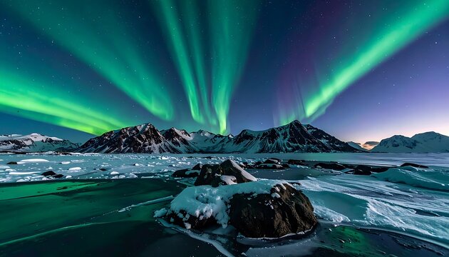 A breathtaking panoramic view of the aurora borealis dancing over snow-capped mountains