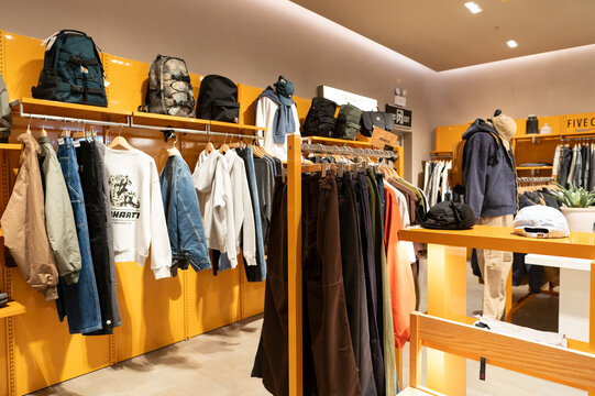 Apparel displayed on racks inside I.T store at KK Mall